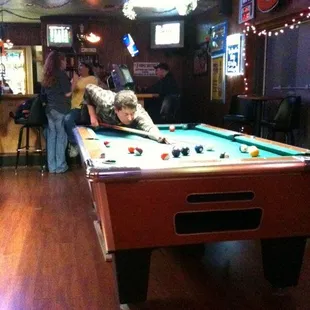 a man playing pool