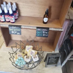 a shelf with bottles of essential oils