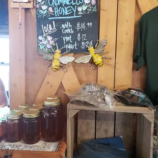 a display of honey jars and other items