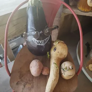 a wooden chair with vegetables on it