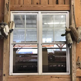 a window with stuffed animals on it