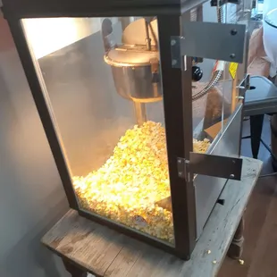 a popcorn machine with popcorn in it