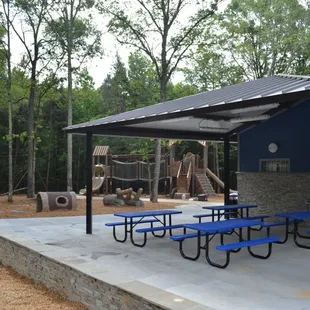 Small Shelter that is directly at the playground.