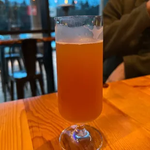 a glass of beer on a table