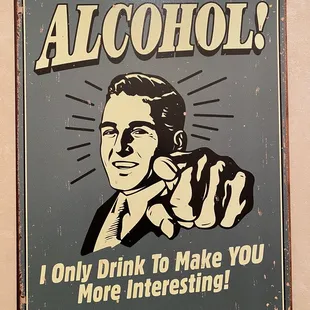 a man holding a glass of alcohol