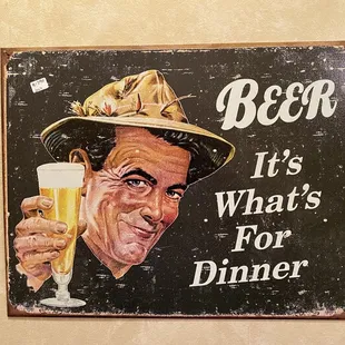 a man holding a glass of beer