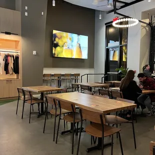 people sitting at tables in a restaurant