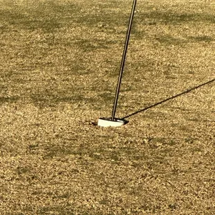 Cup falling out of hole.