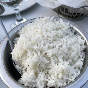 a bowl of rice with a spoon in it