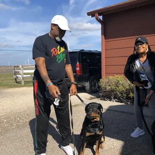 Our clients and their fur baby leaving the clinic after their dog received all of his vaccines.