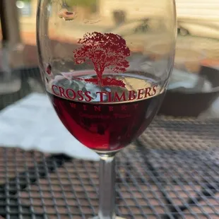 a glass of wine on a table