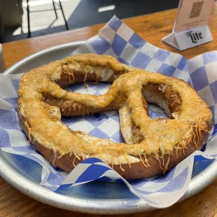 a pretzel on a blue and white checkered plate