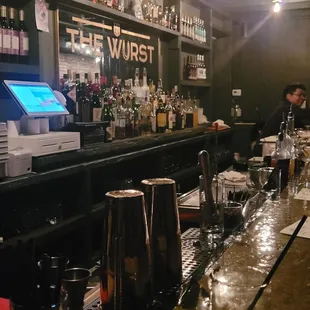 a man behind the bar at a bar