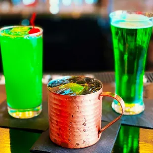 two cocktails on a bar