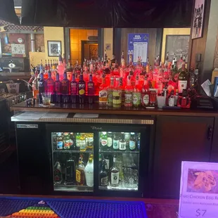 a bar filled with bottles of alcohol