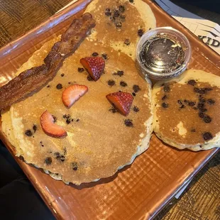 Chocolate chip Mickey Mouse pancake with bacon.