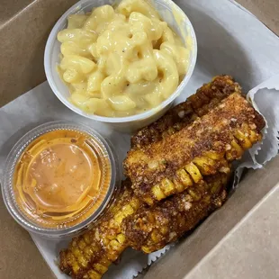 Side of Mac and cheese and corn ribs and hot cross dipping sauce