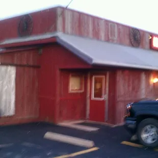 a man walking in front of a restaurant