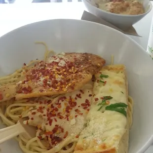 a bowl of spaghetti and chicken