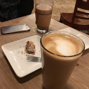 A bite of blueberry crumb cake with two caramel coffees. Delicious!
