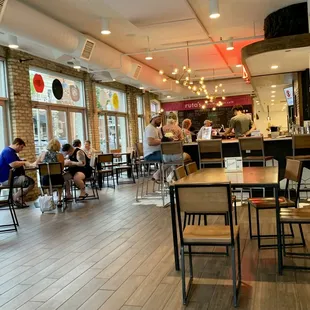 people eating at tables in a restaurant