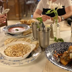 Tomato bisque, Spinach Artichoke dip, and empanadas.