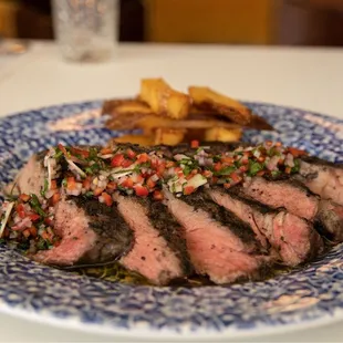 a plate of steak and fries