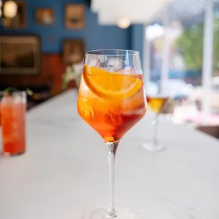 a drink in a glass on a counter