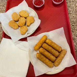 a tray of food including tater tots and ketchup