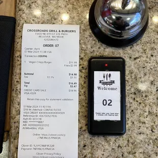 Receipt for crispy burger and fries, and revised device that tells you your food is ready.