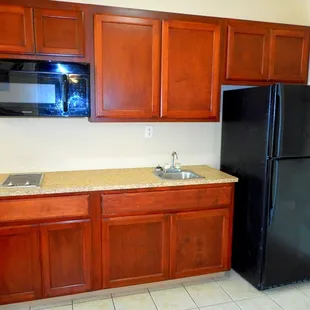 Full Kitchenette, sink stove top, microwave and full size refrigerator and freezer