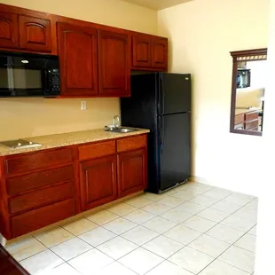 Full Kitchenette, sink stove top, microwave and full size refrigerator and freezer