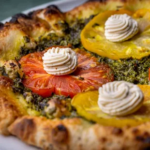 Basil Pesto &amp; Heirloom Tomato Pizza (gluten free crust is available as well).