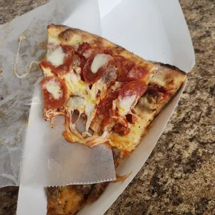 (Top slice) Sausage and pepperoni  (bottom slice) Sausage and cheese