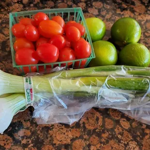 Green onions, grape tomatoes, and limes