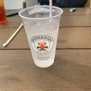 a drink in a plastic cup with a straw