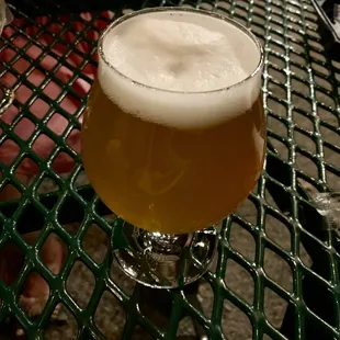 a glass of beer on a table
