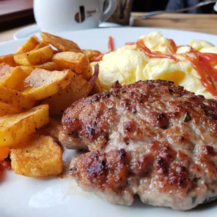 House-made sausage patty with soft scrambled eggs and roasted potatoes