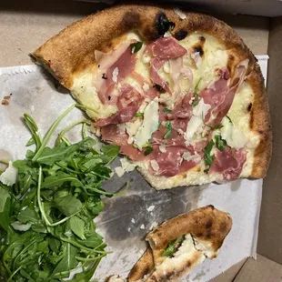 Leftover pizza, took arugula off to keep crunchy-- perfect the next day