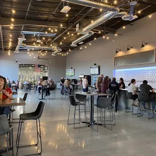 a large group of people sitting at tables