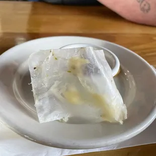 Piece of paper from cheese from burger I bite into