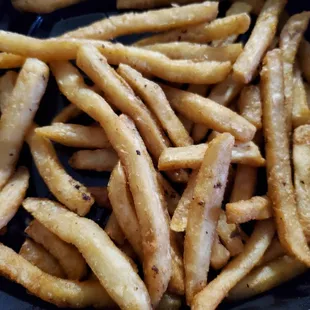 Lukewarm fries cooked in dirty oil.