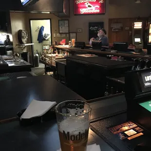 a pint of beer on the bar