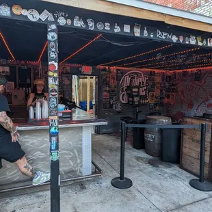 a man standing at a bar