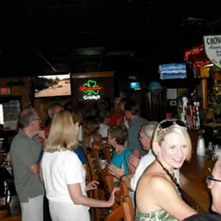 a group of people at a bar