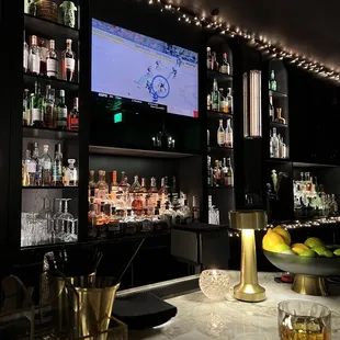 a bar with a large screen tv