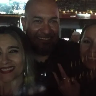 three people posing for a picture