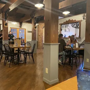 a dining room with tables and chairs