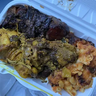 Jerk and curry chicken, rice and peas, Mac and cheese