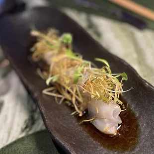 Flounder Crudo Flounder sashimi, topped with fried leeks, cilantro, sauce (vinegar, soy)